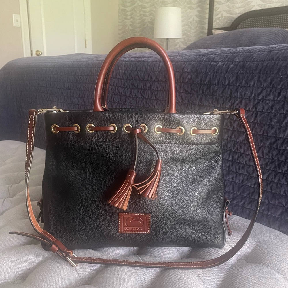 Dooney & Bourke Leather Pebble Grain Tassel Tote in black with brown accents